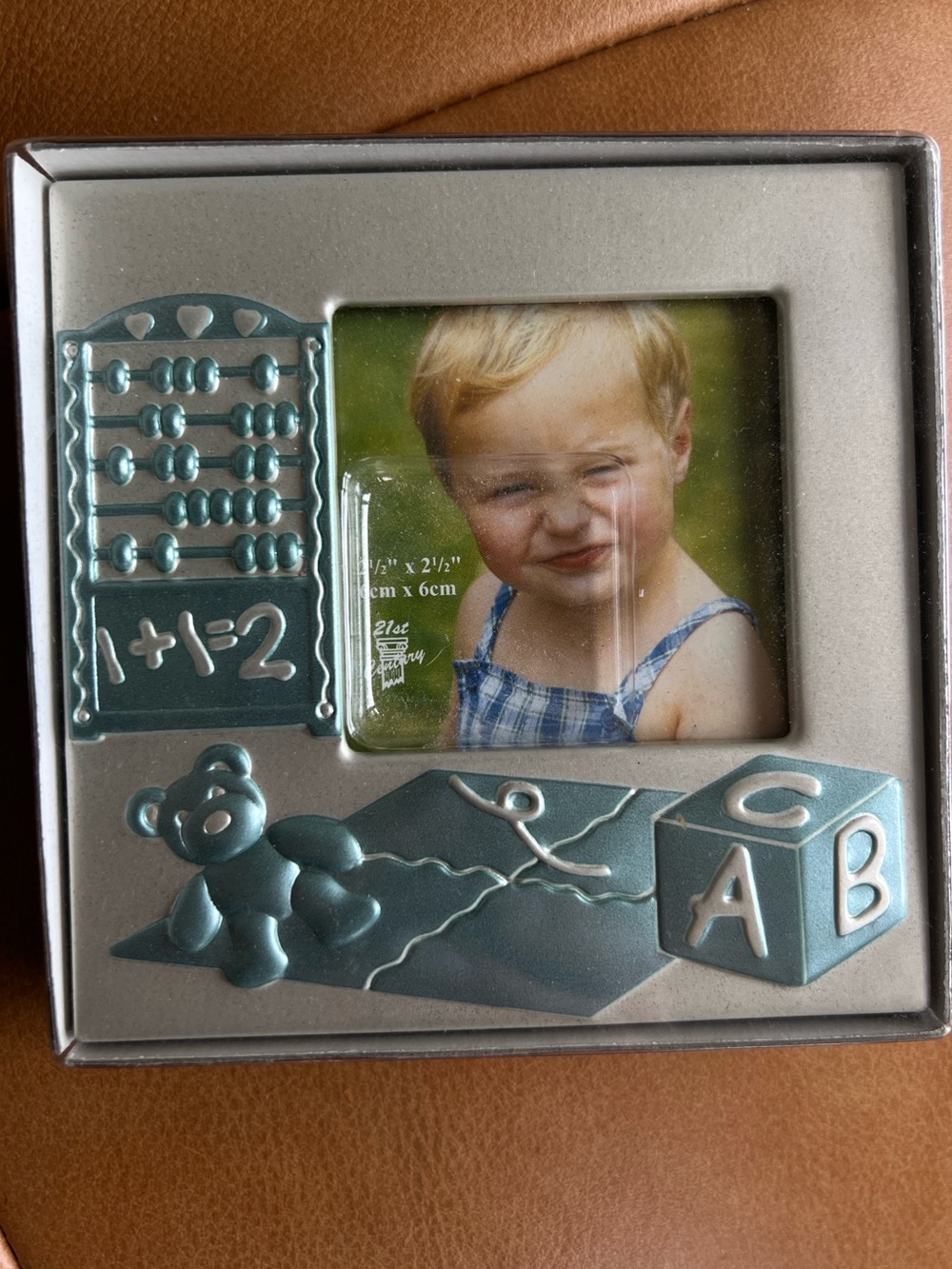 Silver and Blue Children's Picture Frame with Toy Motifs